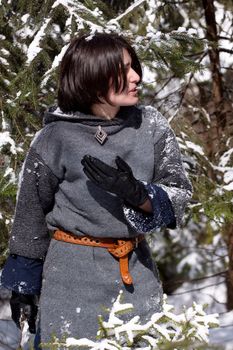 Girl in gray dress and snow tree
