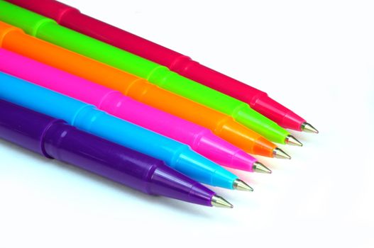 Set of multicolor pens on white background