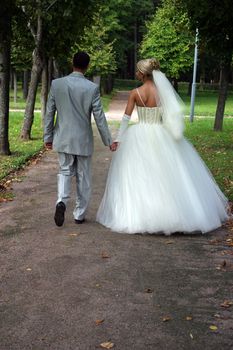 Newly-married couple in park