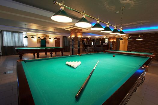 Table for game in billiards in modern hotel