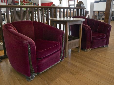 Antique velvet arm chairs inviting and comfortable.