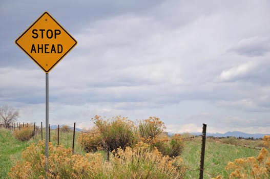 A traffic sign stands in a field in Colorado.