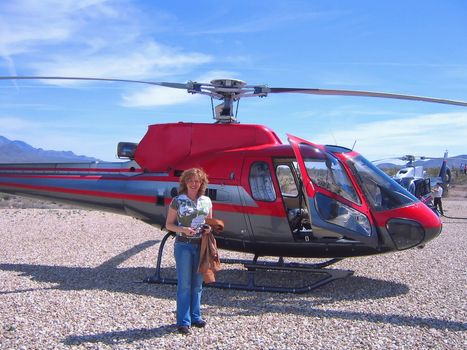 a tourist is getting ready to take a tour in an helicopter