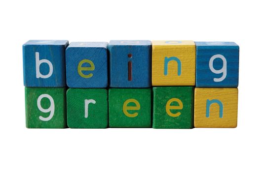 the phrase 'being green' isolated on white