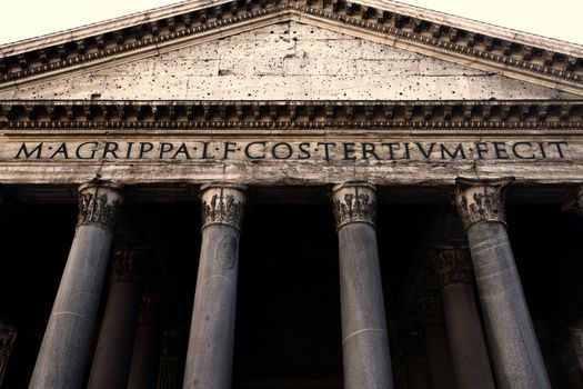 Image of the facade of the Pantheon in Rome, Italy. Shot with wide angle lens at a low angle.
