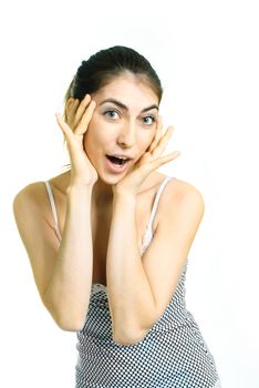 portrait of a beautiful young surprised woman closing her face with hands