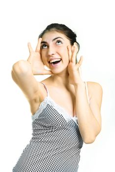 portrait of a beautiful young surprised woman closing her face with hands