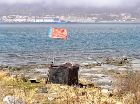 Landscapes of Sakhalin, flag at the sea