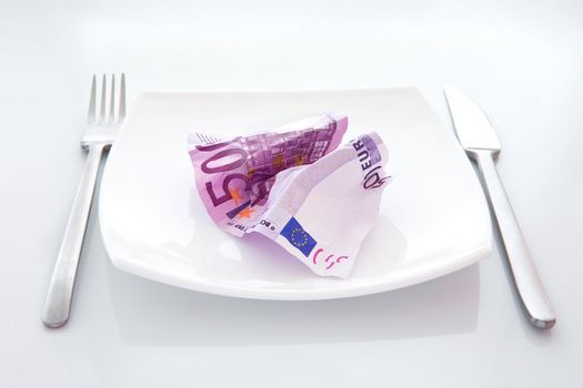 Denomination five hundred euros on a plate
