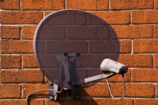 satellite antenna on the wall of one of the houses in the vicinity of Liverpool / United Kingdom, 16.05.2009 