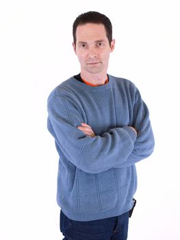 A man in a blue sweater folding his arms, isolated on a white background.