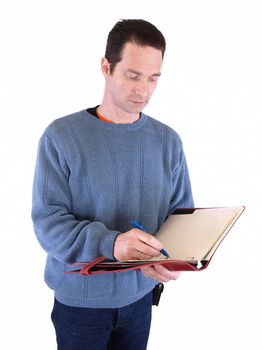 An adult male taking notes in a binder, isolated against a white background.