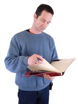 An adult male looking over notes in a binder, isolated against a white background.