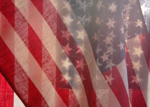 two backlit American flags in a unique view of the stars and stripes