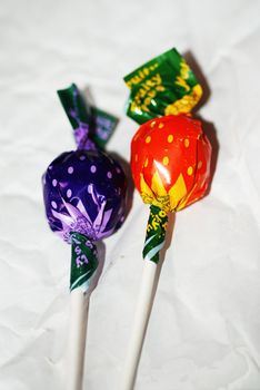 A photograph of two lollipops, ready for a treat for a child