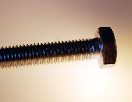 A macro photograph of a hex head screw