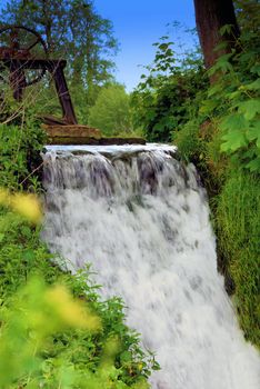 Waterfall at the edge of Hothfield lake in Kent