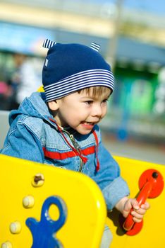 cute little three year old boy playing outdoor in the park