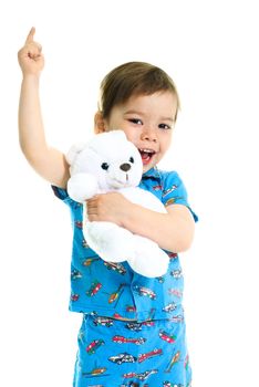 cute little three year old boy with his hand up holding a toy bear 