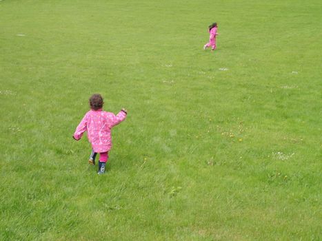 kids running in the grass