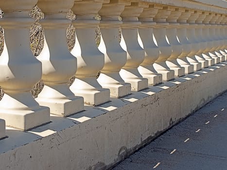Elegant pedestal bridge casting afternoon shadows.