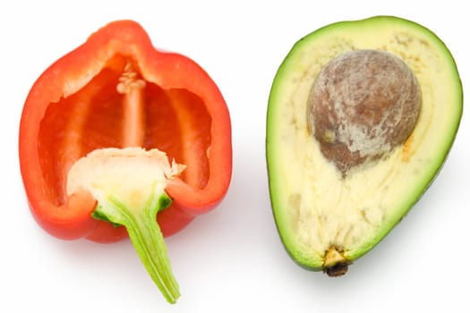 Red sweet pepper and green avocado on a white background