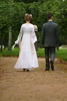 The bride and the groom in park