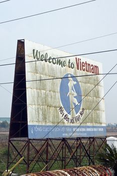 Signpost on the Cambodian / Vietnamese border, welcoming visitors to Vietnam. A bit old and worn out, but still charming.