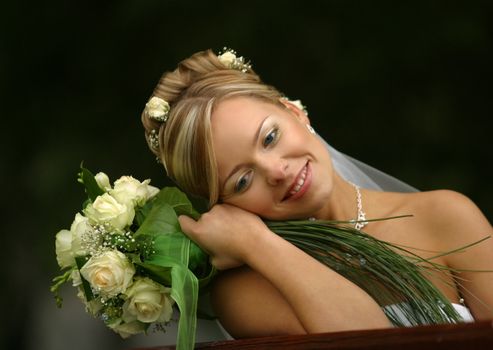 Portrait of the beautiful bride with a bouquet