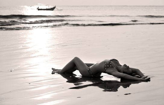 The beautiful girl on a coast of ocean