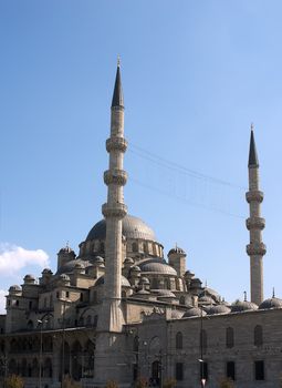 Mosque in Istanbul with two minarets over blue sky