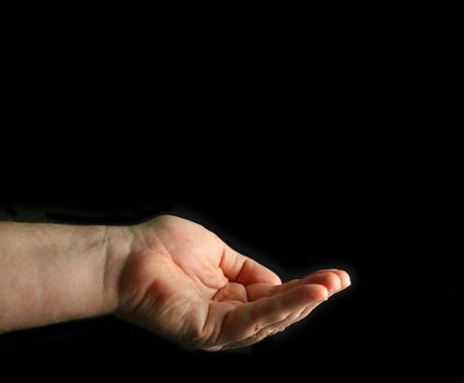 Cupped hand isolated on black.