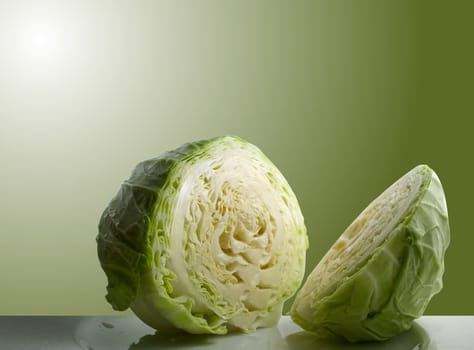 Sliced cabbage with green background