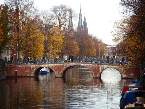 Canal and bridge in Amsterdam in late fall