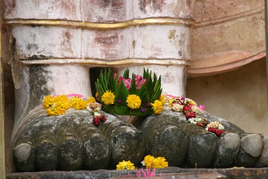 Feet of one of the many buddha's at Sukhotai Historical park Thailand