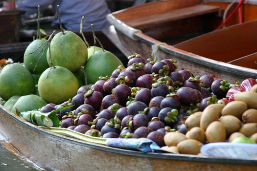 Fruit for sale at the floating market at Damnoen Saduak, Thailand