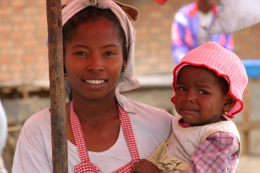 Mother and child at a market in Madagascar