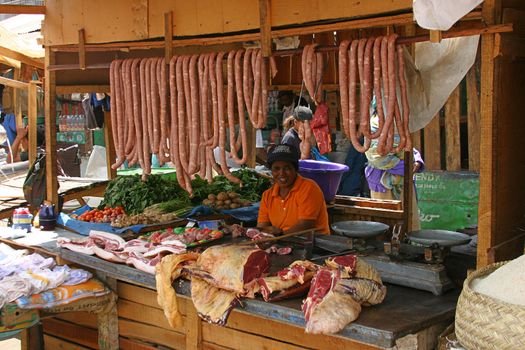 Meat stall in Madagascar where the freshly cut meat is hanging on display