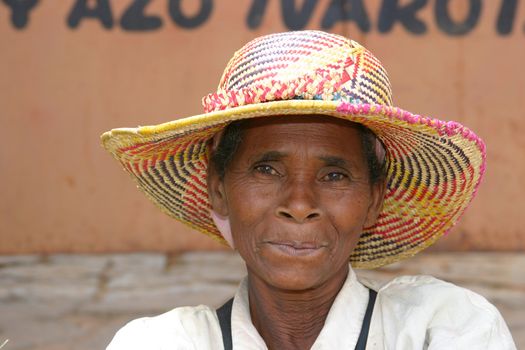 Pretty elderly lady at a market in Madagascar smiling