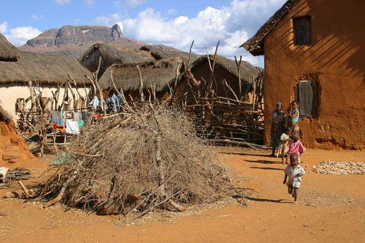 A small village in Madagascar with kids running around

