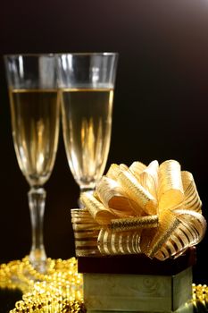 holiday card golden champagne and gift