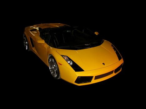 A hot yellow sports coupe over a black background.