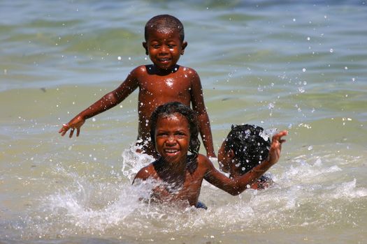 Young kids playing in the sea at Ifaty, Madagascar