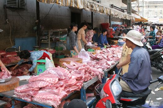 Selling meat at a market in saigon, Vietnam