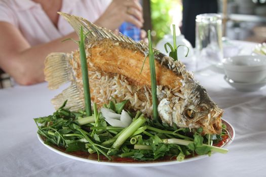 Freshly prepared elephant ear fish in a restaurant in Vietnam