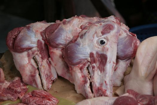 Fresh cows heads for sale at a market in Mekong Delta