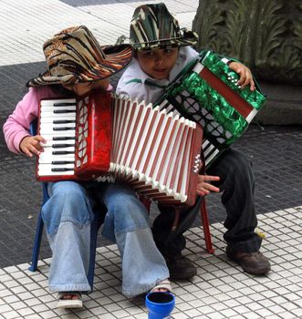 Two young street musicians in Buenos Aires, Argentina.