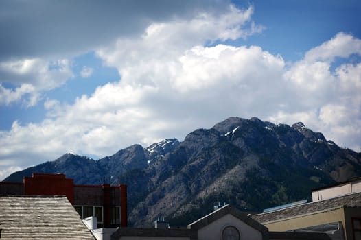 Image of rooftops and mountain in Banf Alberta.