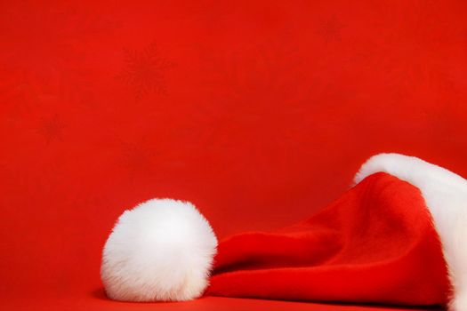 Red santa hat against a red background