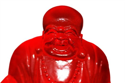 A statue of the Laughing Buddha made out of red glass, isolated on a white background.